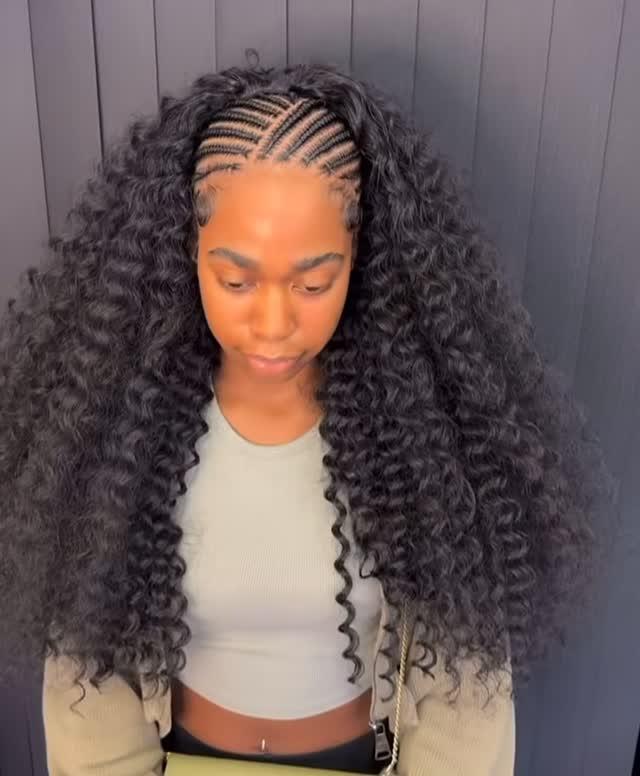 Cornrowed crown released into curly lengths